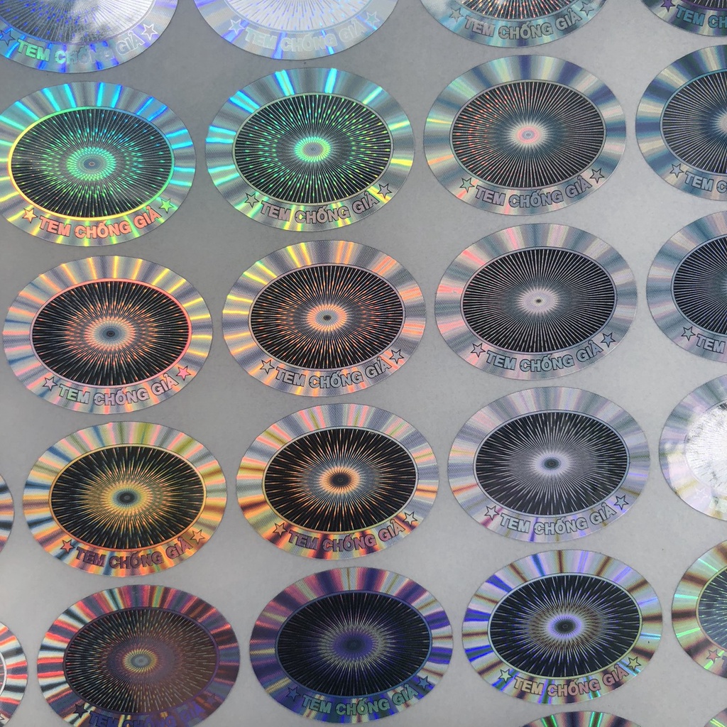 Tem niêm phong chống giả hologram 7 màu 1.5x2cm oval in sẵn combo 1.000c