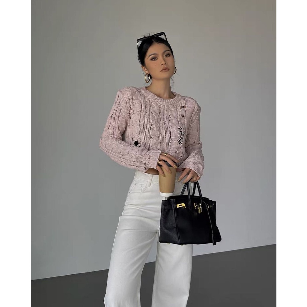 Mùa thu mới thời trang rộng vai ngắn miếng đệm rách lỗ chui đầu áo len dệt kim dài tay nữ