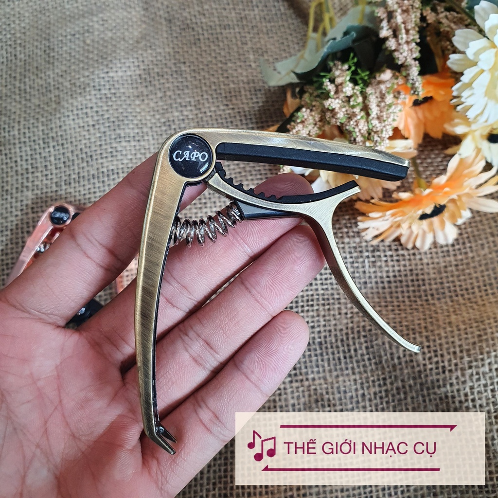 Capo kim loại có móc gỡ chốt giữ dây đàn guitar