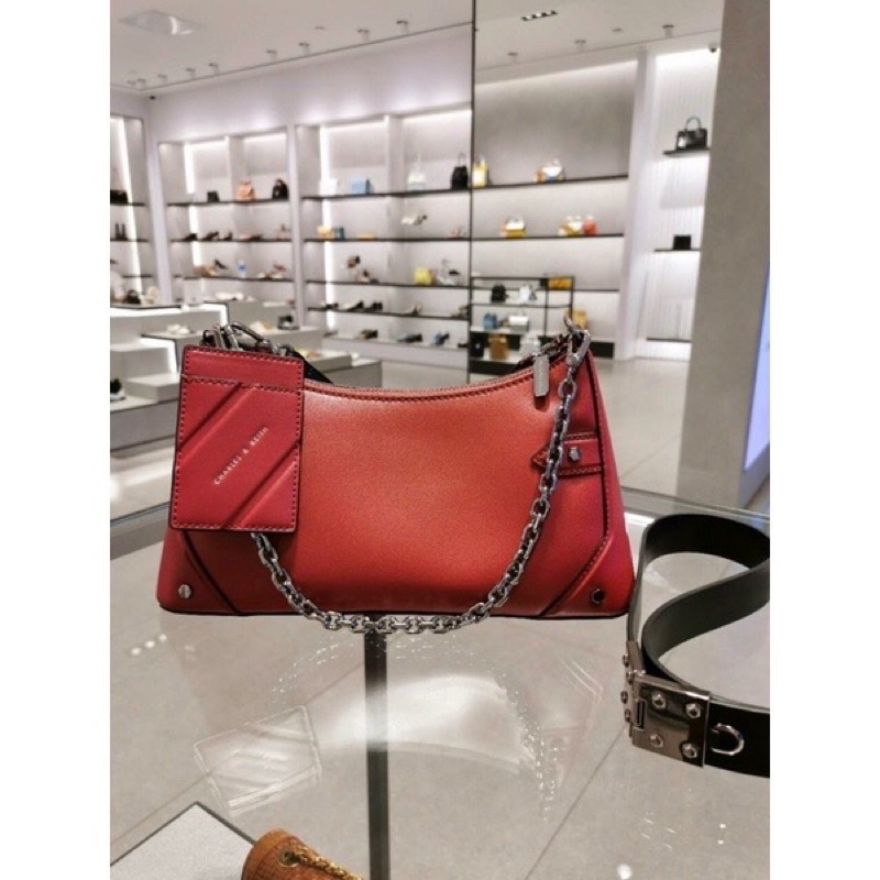 Túi cnk đeo chéo kẹp nách màu đỏ