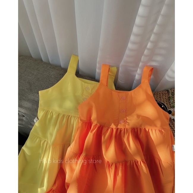 Váy vàng cam xoè tầng cho bé gái