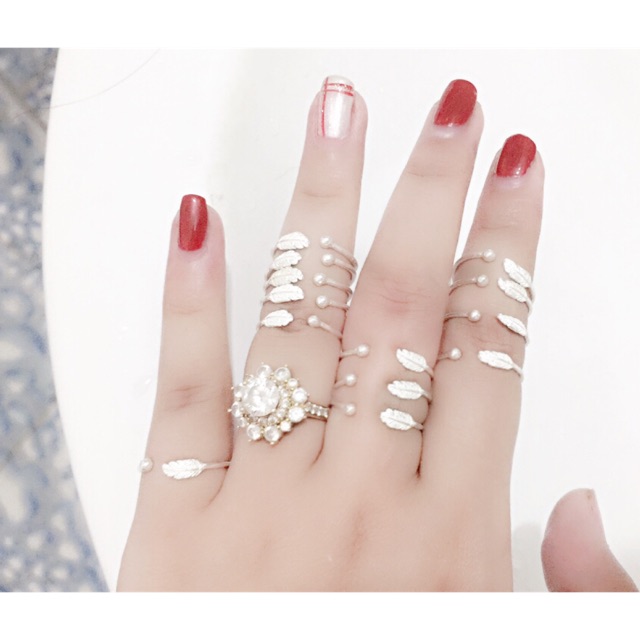 Nhẫn lông vũ bạc ta