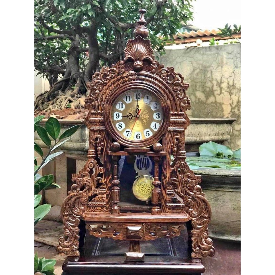Đồng hồ để bàn (gỗ mun đuôi công) .