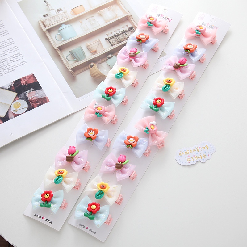 Kẹp tóc cho bé kiểu nơ hoạt hình