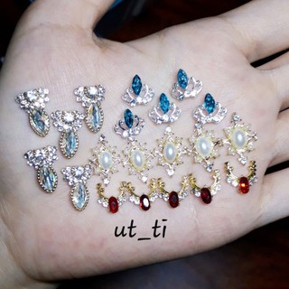 2 charm vàng nail đá + ngọc mã 93 .