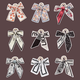 Thun cột tóc đính ngọc trai giả và nơ chất liệu lụa