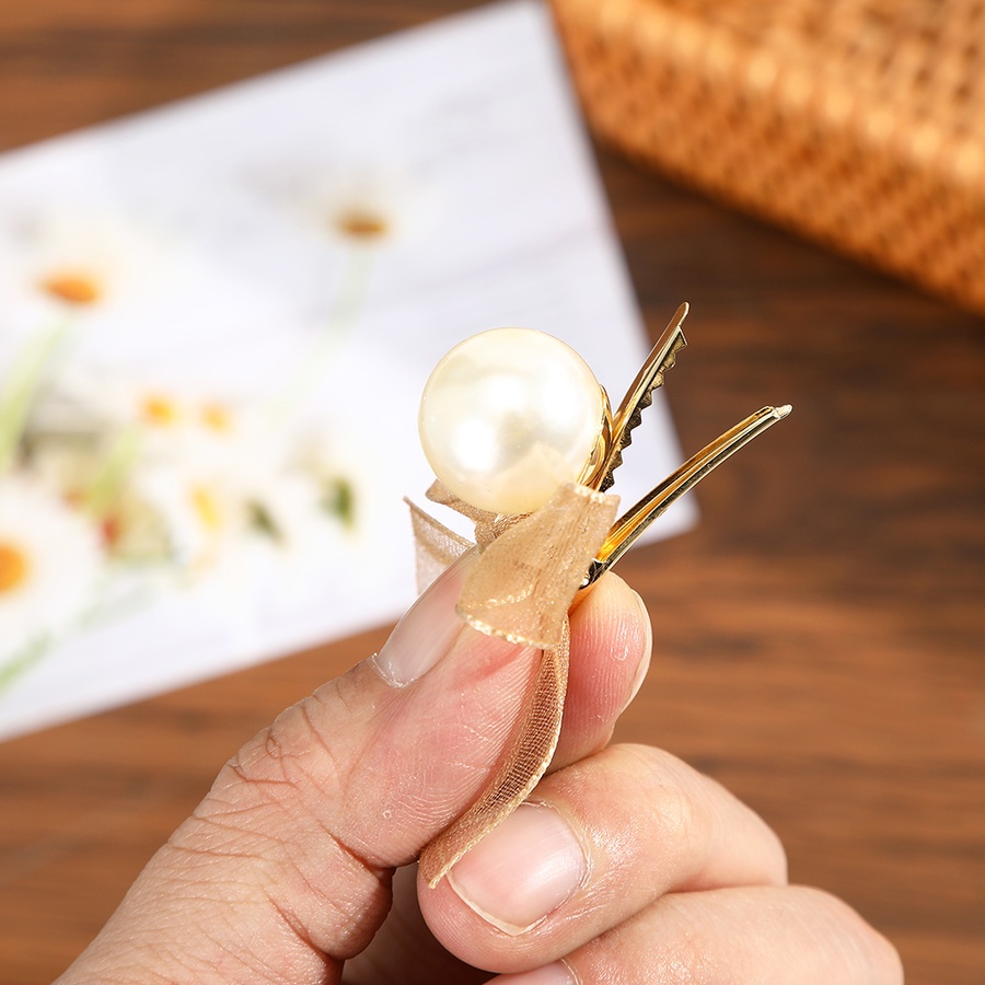 Kẹp tóc hình nơ đính ngọc trai xinh xắn dành cho nữ