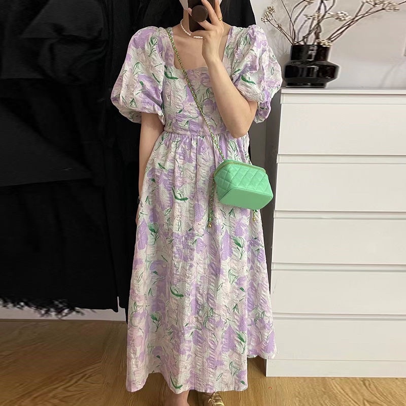 Đầm hoa dáng dài tay bồng màu loang nhạt hở lưng mùa hè 2022