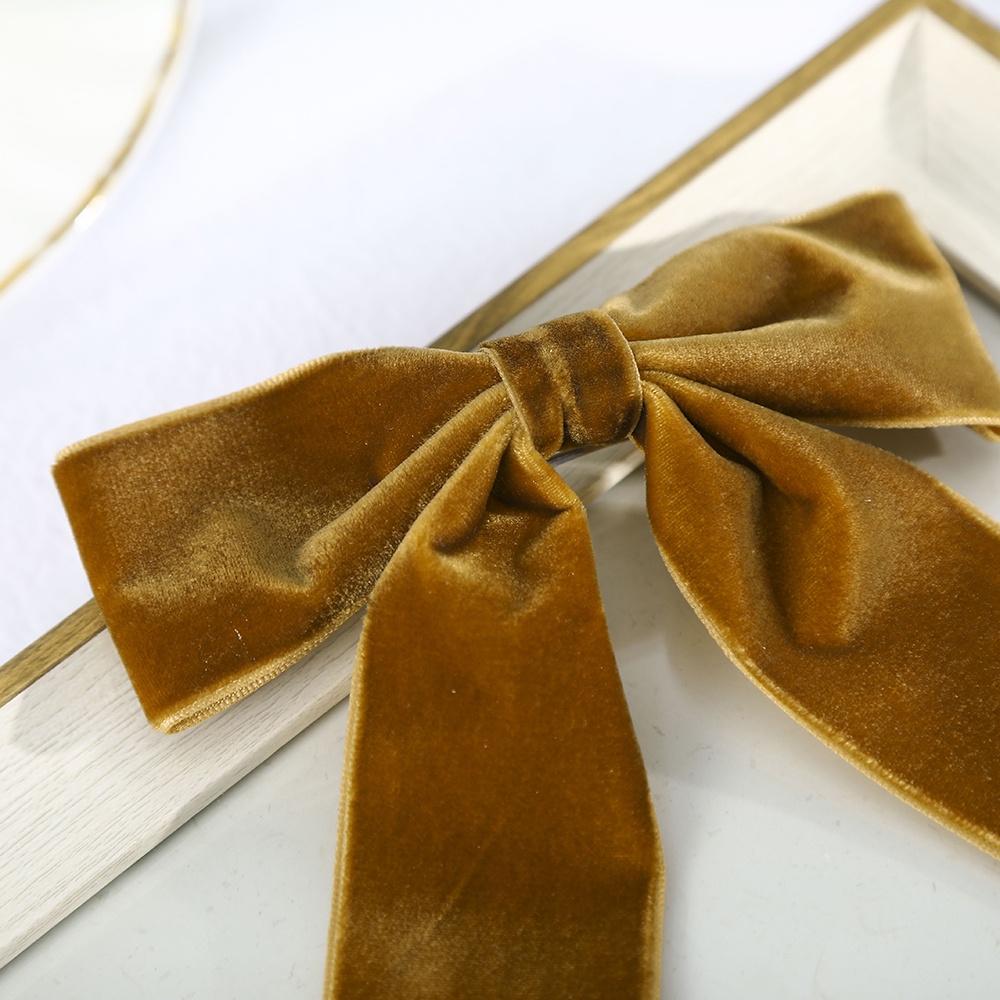 Kẹp tóc Haimeikang gắn nơ đính ngọc trai bằng