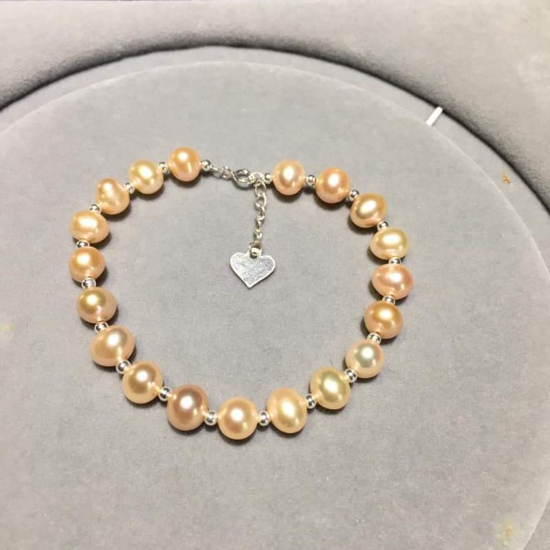 Vòng tay trai nước ngọt phối bi bạc xi vàng