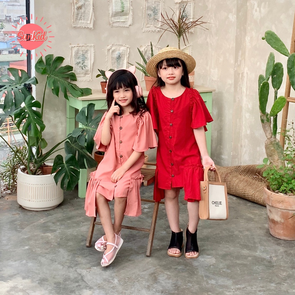 Váy đầm bé gái xòe cách điệu hè đính cúc vải trượt nhật cao cấp Sunkid KC màu đỏ, hồng size trẻ em 4-12 tuổi t