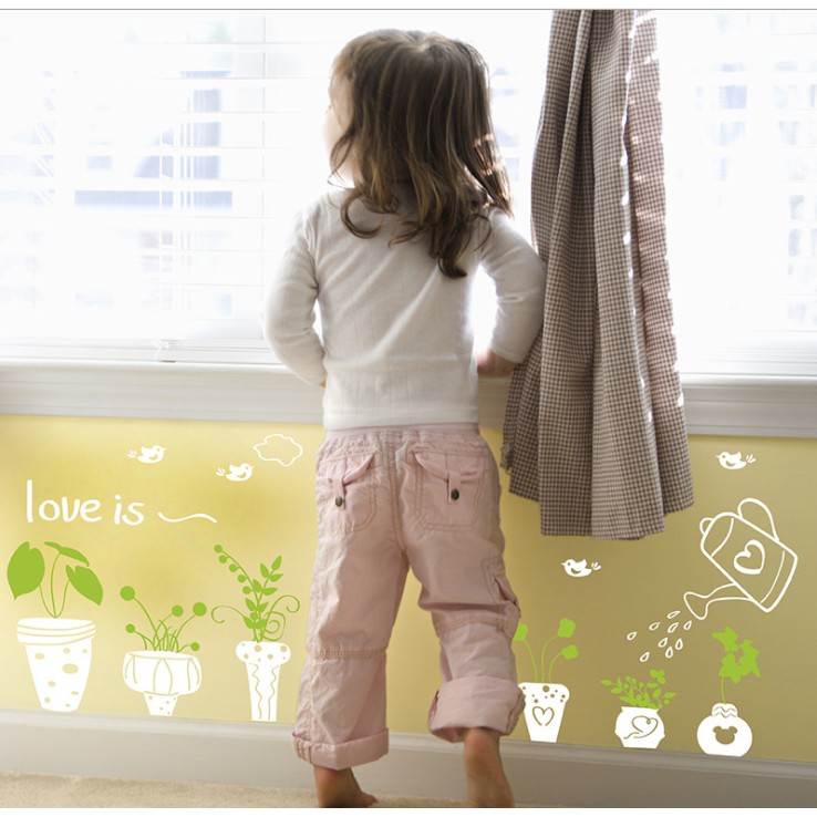 Decal trang trí tường - Nhiều chậu họa tiết trắng chữ love is
