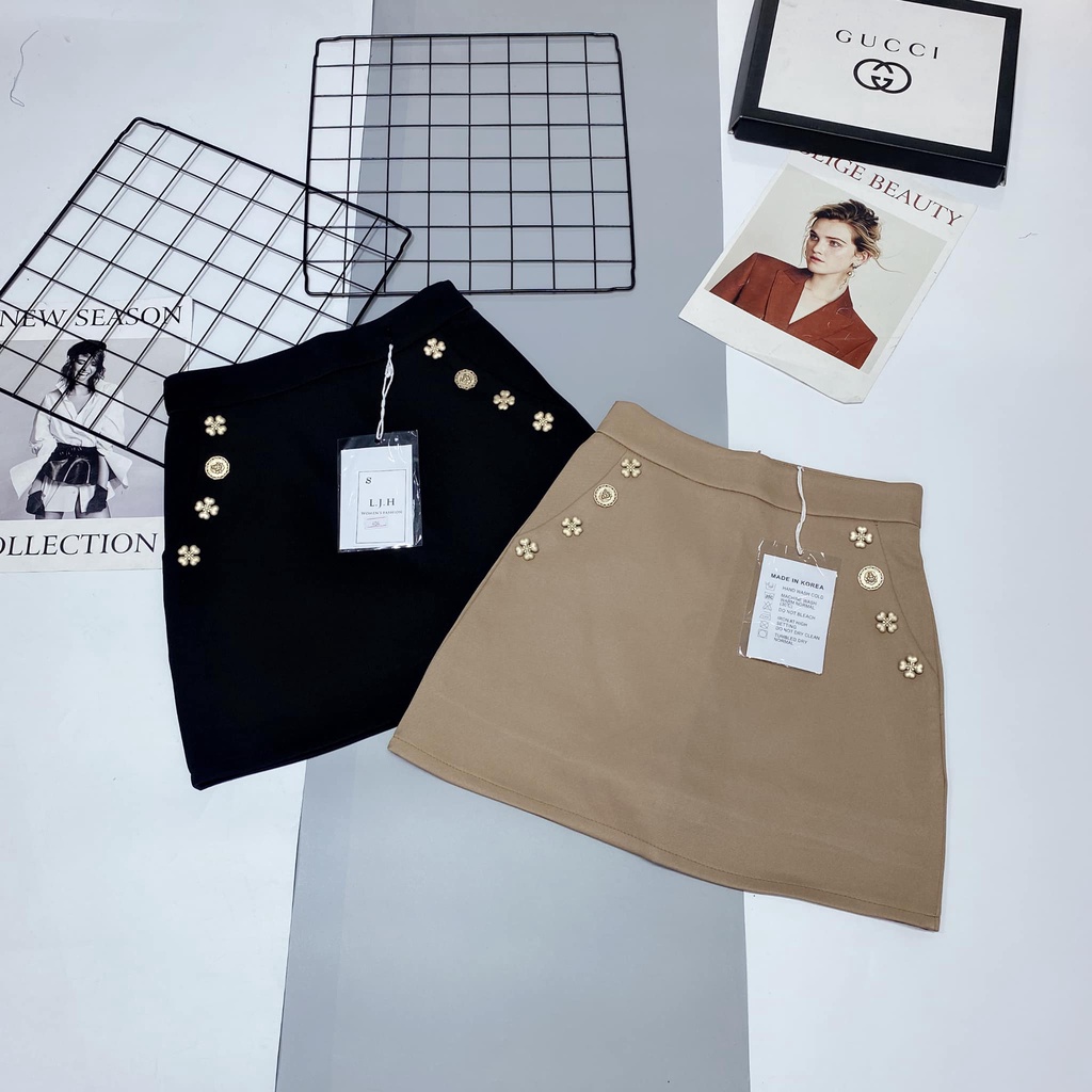 Chân váy chữ A đính cúc hoa