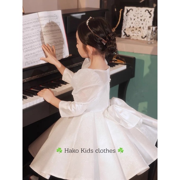 Váy trắng tay bồng đính ngọc hk bé gái