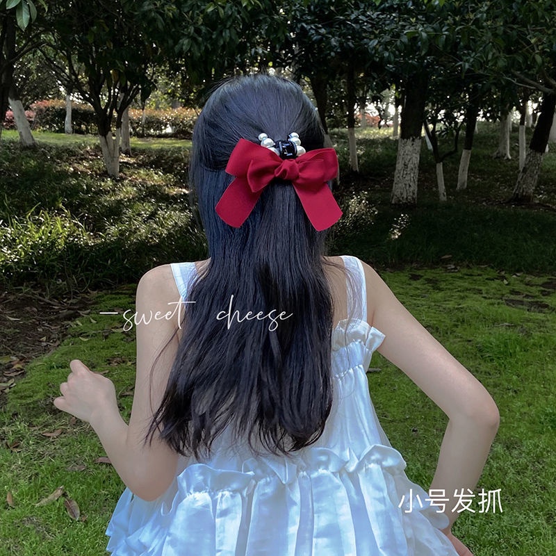 Kẹp càng cua đính hạt phối nơ voan địu đà