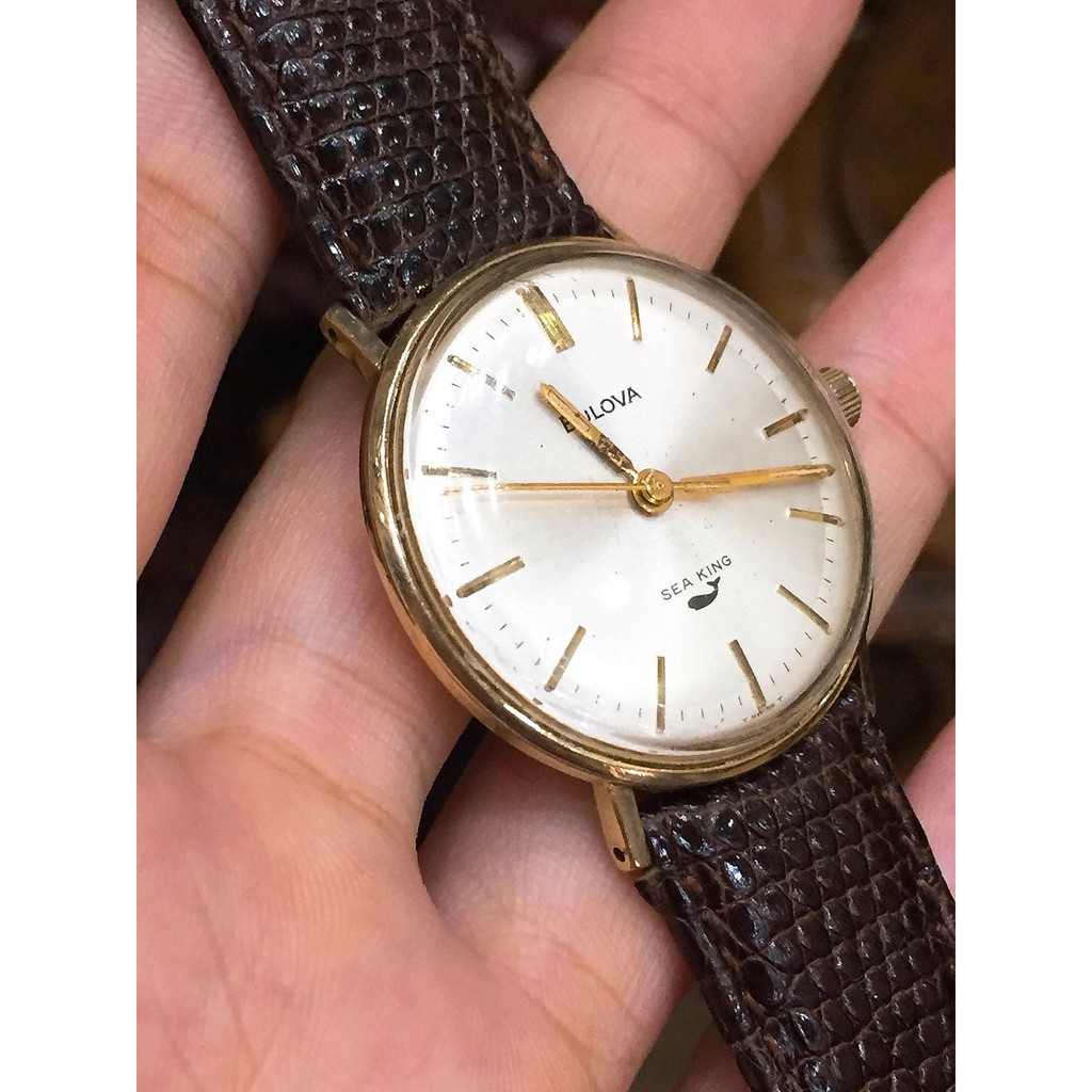 Đồng hồ nữ Bulova Cơ cót lắc kê vàng, mặt mỏng, dây da cá sấu