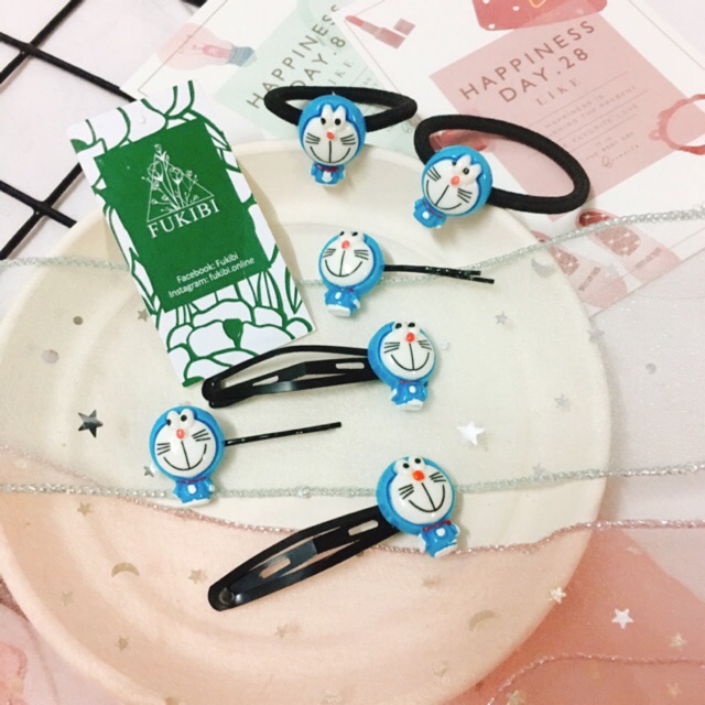 CỘT TÓC, KẸP TÓC DORAEMON ẢNH THẬT