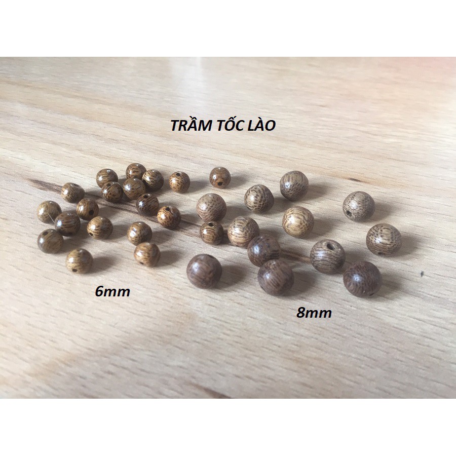 1 Hạt trầm hương tốc lào màu nâu vàng, dùng xâu vòng đeo tay, vòng đeo cổ