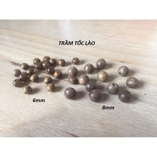 1 Hạt trầm hương tốc lào màu nâu vàng, dùng xâu vòng đeo tay, vòng đeo cổ