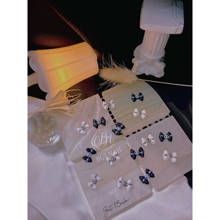 Charm nơ trắng đen 15viên