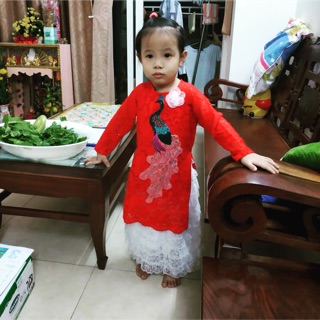 Áo dài cach tan hinh chim công