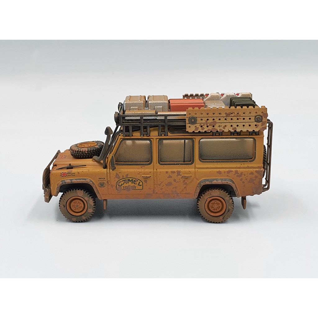 Xe Mô Hình Land Rover Defender 110 1989 Camel Trophy Winner Team UK RHD Tỉ lệ 1:64 Hãng sản xuất MiniGT ( Vàng Bụi )