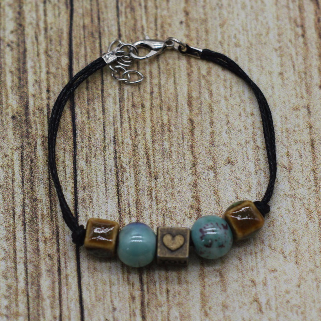 VT28 Vòng tay hạt gốm mix charm 5 cái/lốc