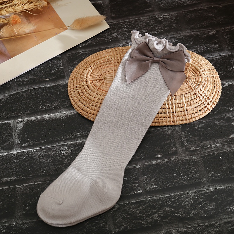 Đôi Vớ Cotton Mềm Mại Co Giãn Giữ Ấm Mùa Đông Đính Nơ Hoạt Hình Dành Cho Bé Gái Sơ Sinh