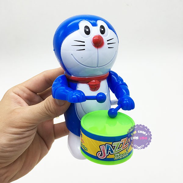 Đồ chơi Doraemon đánh trống vặn cót bằng nhựa