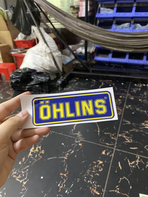 Tem xe chữ OHLINS dán mọi nơi luôn keo