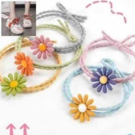 -  Combo 100 Dây buộc tóc cột tóc hoa cúc