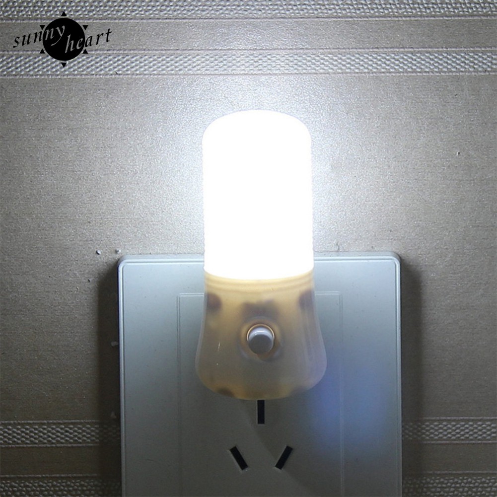 Đèn ngủ led màu trắng ấm 3W đặt cạnh giường ngủ