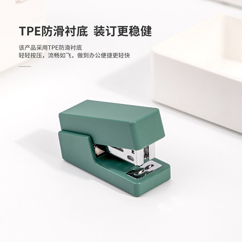 Deli Newcomer Mini Stapler Kích thước nhỏ cầm tay dễ thương và tiết kiệm sức lao động đặt cho học sinh