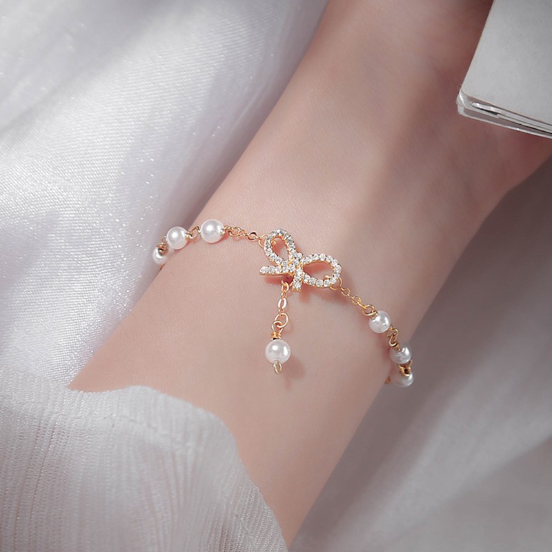 Vòng Tay Chuỗi Hạt Ngọc Trai Mặt Hình Nơ Đính Pha Lê Phong Cách Hàn Quốc Ngọt Ngào Cho Nữ