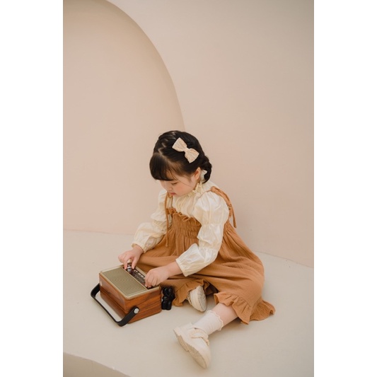 Váy hai dây cho bé chất muslin P'ti chou ( Petit dress ) thiết kế nhún ngực dây buộc nơ cho bé gái từ 1-7 tuổi