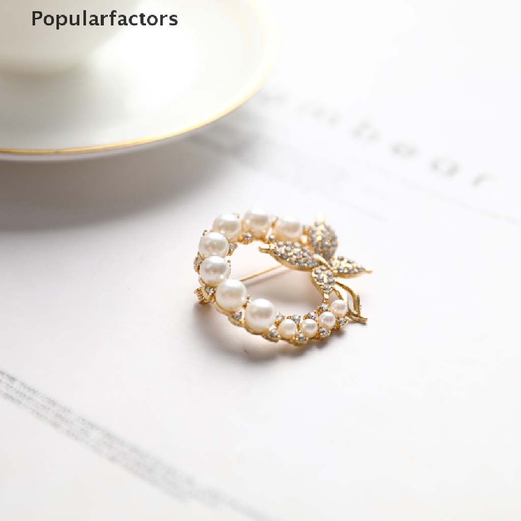 Ghim cài áo hình bướm và ngọc trai thanh lịch