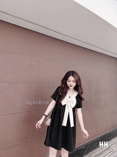 Váy suông nơ ngực trắng cổ V