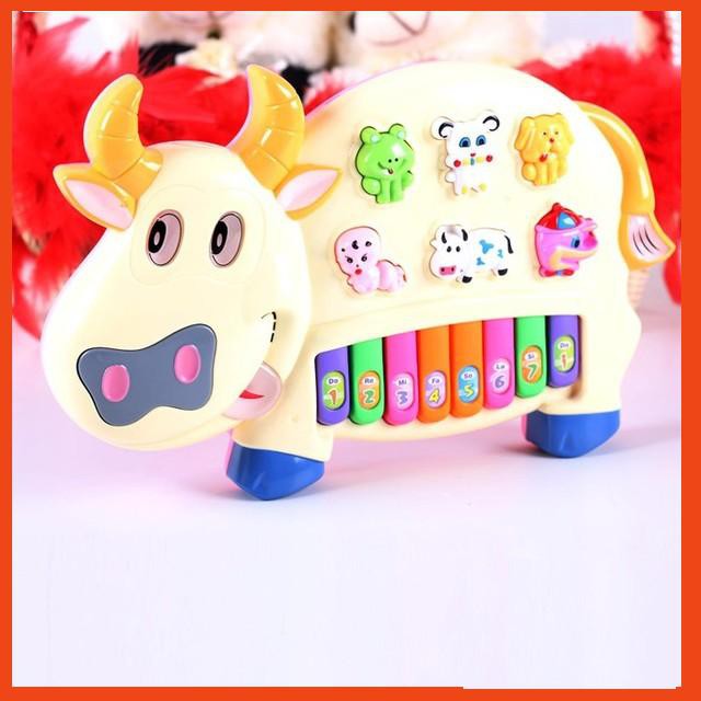 Đồ chơi đàn piano hình chú bò sữa cho bé xanh