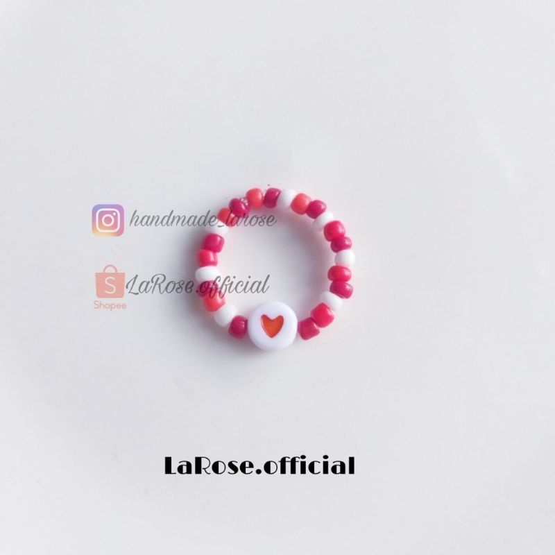 Nhẫn hạt cườm mix charm tim