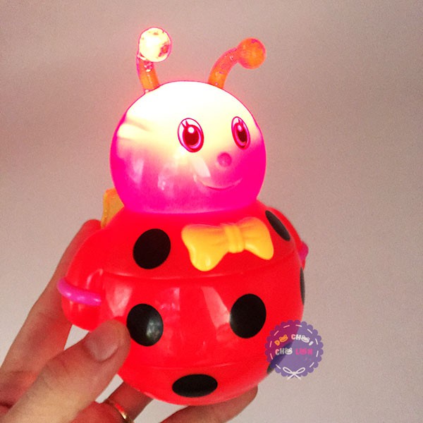 Đồ chơi lật đật ong bằng nhựa dùng pin có đèn nhạc