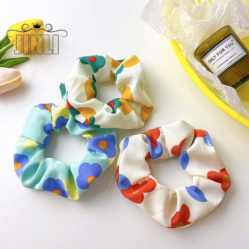 Thun cột tóc hình hoa nhiều màu sắc dễ thương cho nữ