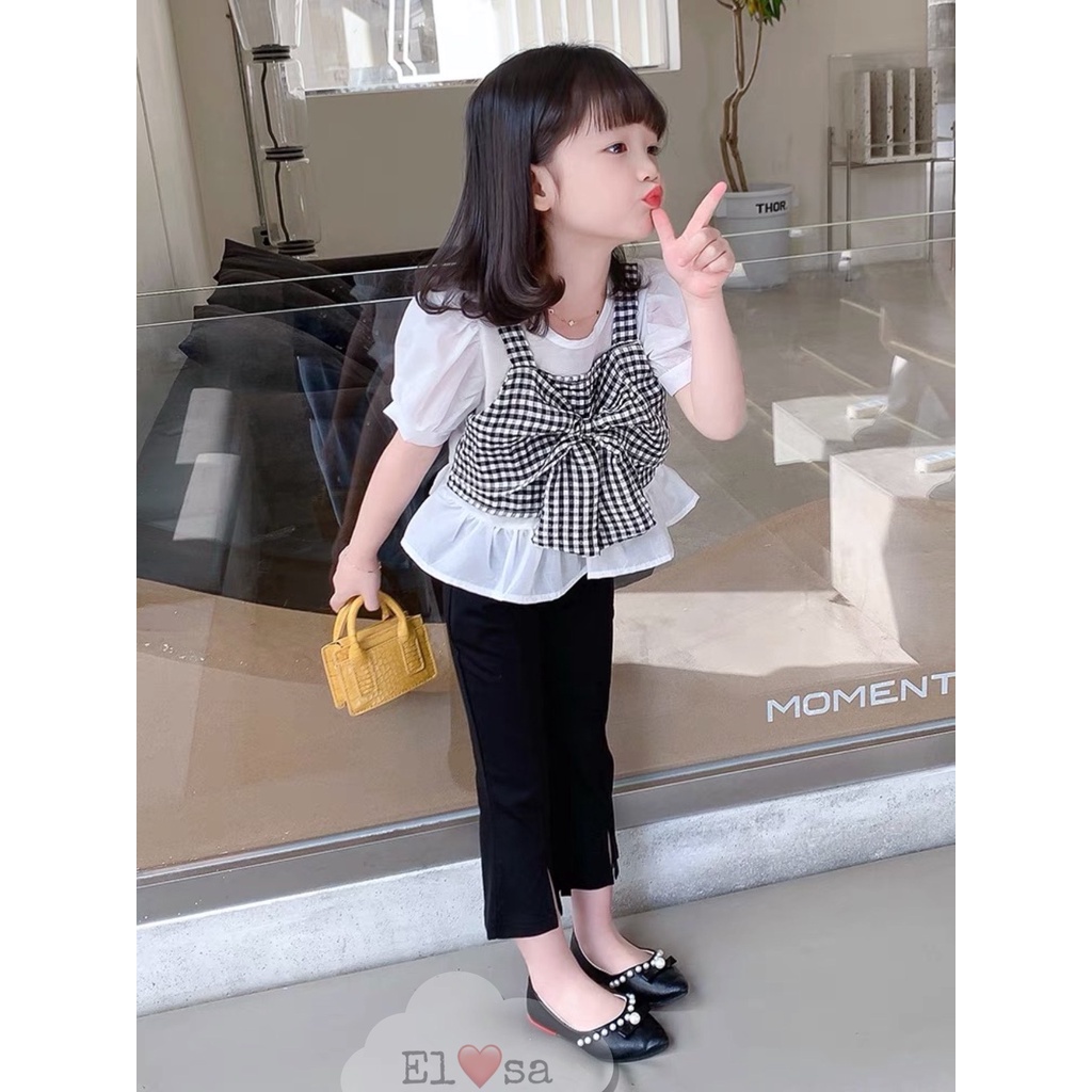 Xả hàng_Bộ bé gái áo nơ kẻ caro đen trắng và quần loe gấu 10-30kg XHN935