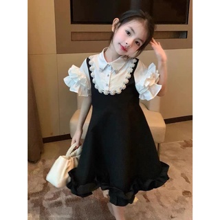Váy đen phối ngọc bé gái