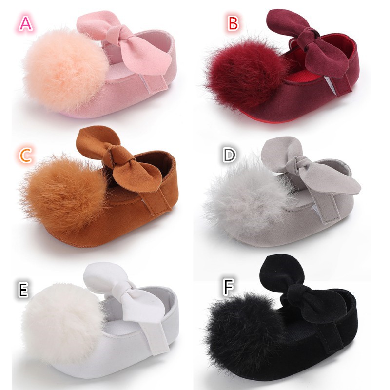 Giày màu trơn đính bông tròn xinh xắn cho bé gái