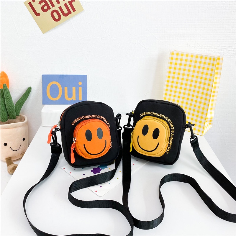 Túi Đeo Chéo Vai Hình Tròn Nhỏ Vải Canvas Họa Tiết Mặt Cười Hoạt Hình Dễ Thương Cho Trẻ Em