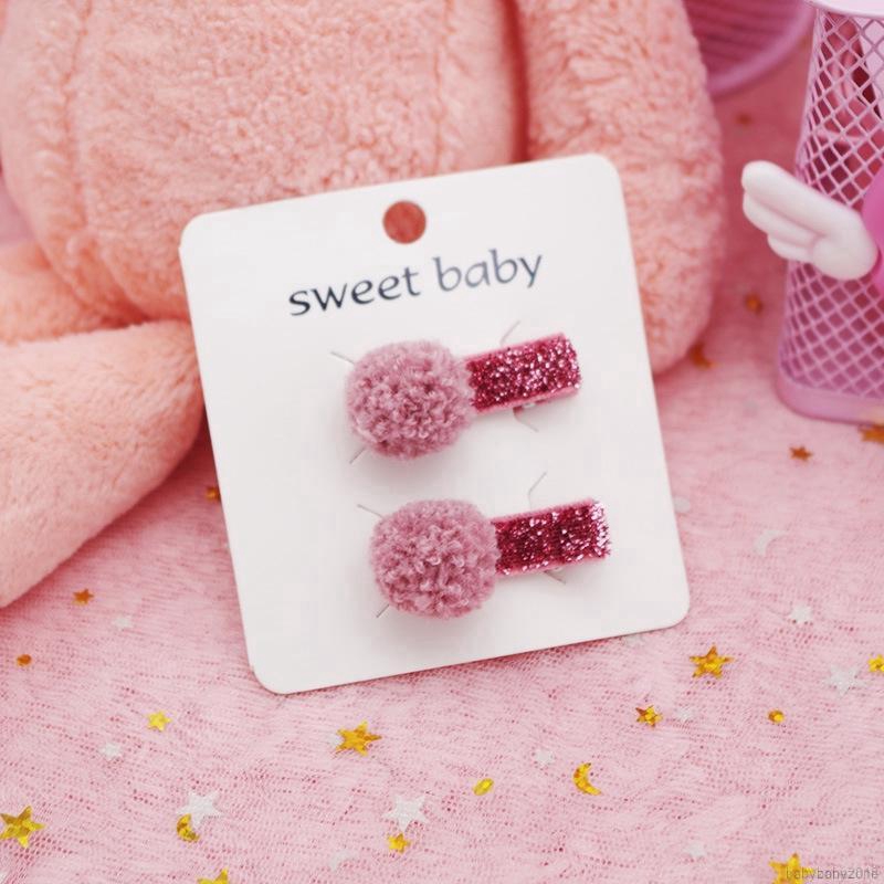 Set 2 kẹp tóc gắn quả cầu lông xinh xắn thời trang cho bé gái
