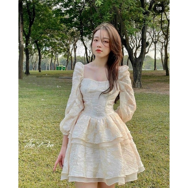 Đầm ren hoa nổi nude cổ U tay dài xoè tầng cut eo viền ren