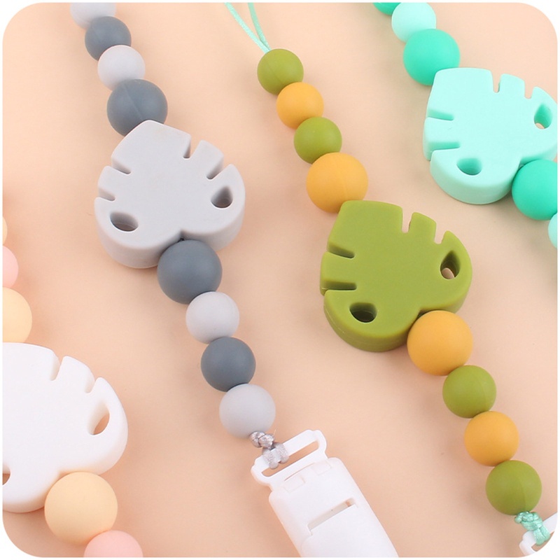 Kẹp Núm Vú Giả Bằng Silicon Hình Chiếc Lá Dễ Thương Cho Bé Sơ Sinh Mọc Răng