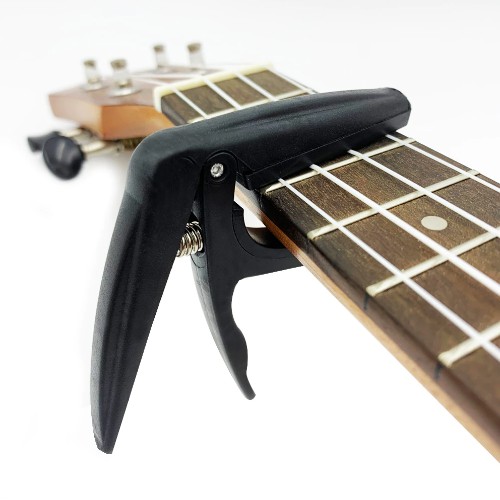 Capo Ukulele nhựa abs Cao cấp (tặng 1c pick xinh xắn)