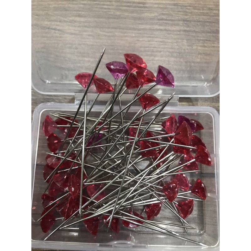 Ghim định vị đan móc áo